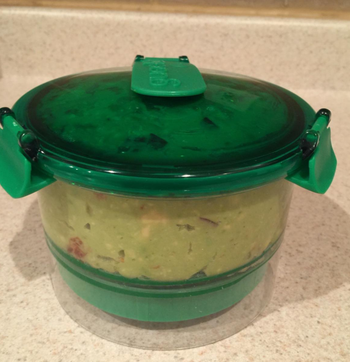 a reviewer photo of the container filled with guac 