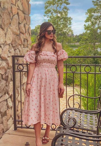 another reviewer in a pink floral dress 