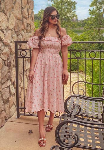 another reviewer in a pink floral dress 