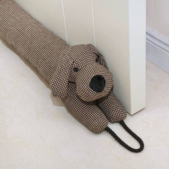 the door draft stopper that's made to look like a little dog