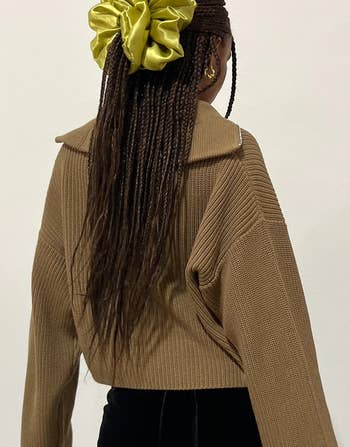 back of model wearing the oversized chartreuse scrunchie in their hair