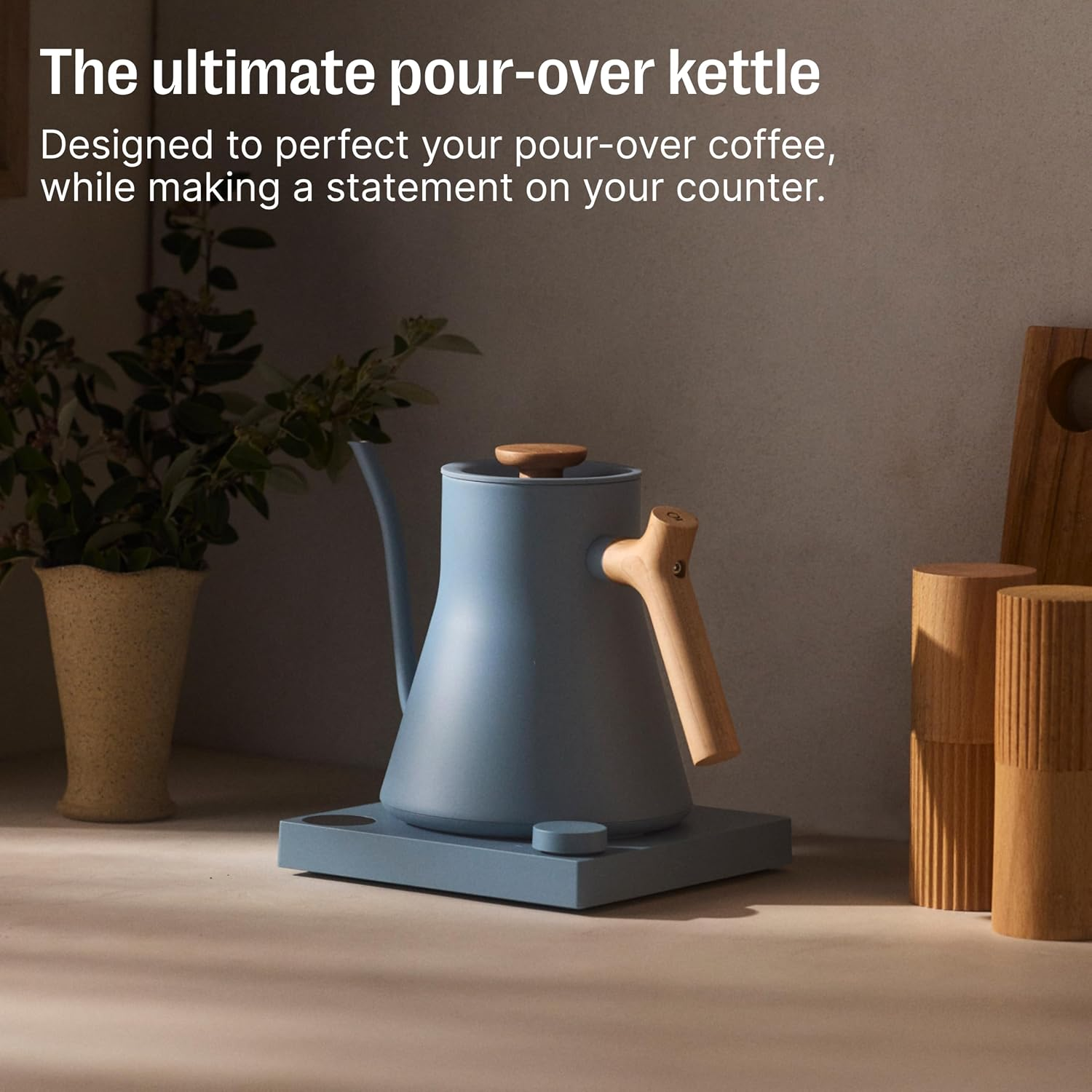 Stylish pour-over kettle with a woody  grip  connected  a countertop, adjacent  to minimalist decor; substance   highlights its plan  focus