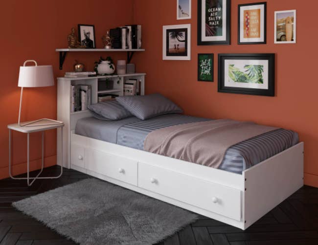 lifestyle photo of white twin storage bed in bedroom