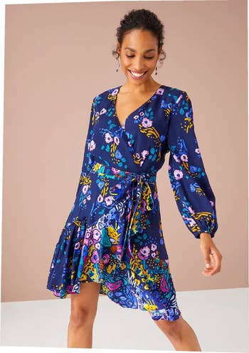model wearing the blue floral print dress