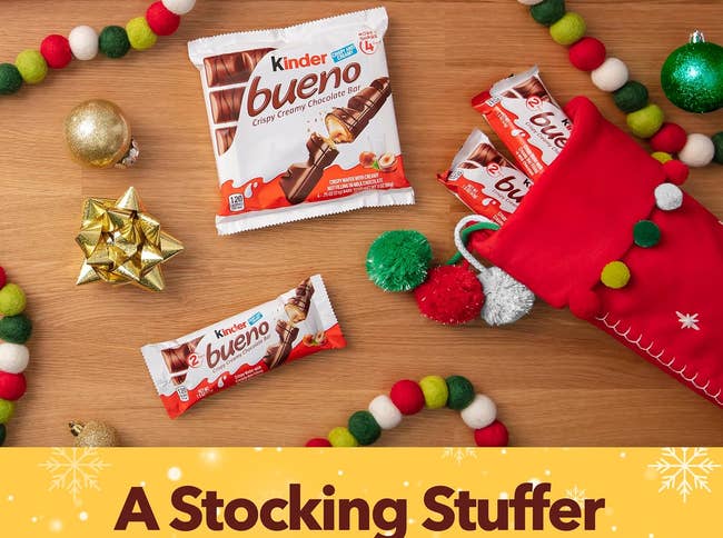the Kinder Bueno bars surrounded by stockings and Christmas decorations