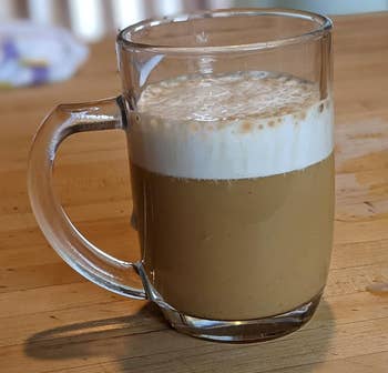  a reviewer's coffee with a thick layer of foam