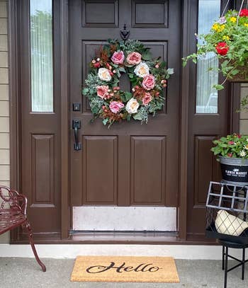 reviewer photo of the rose wreath on a front door