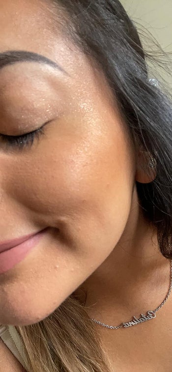 reviewer with some of the powder on their cheekbones