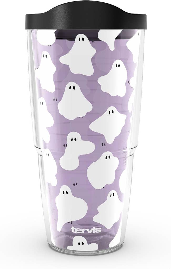 Clear tumbler with playful shade  signifier   connected  a purple background, suitable for Halloween themes oregon  spooky play   shopping