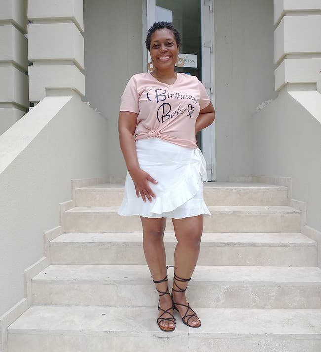 a reviewer wearing the white skirt