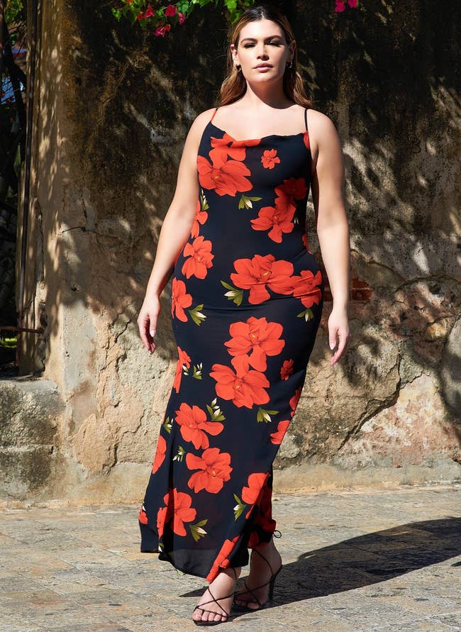 model posing in the black and red floral dress
