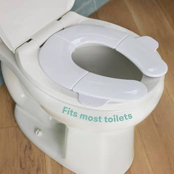 Toilet spot adapter with unfastened front, labeled