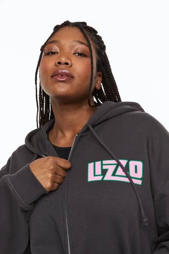 model showing the front of the hoodie with the name 