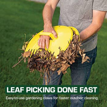 model using the two yellow scoops to pick up a large pile of leaves