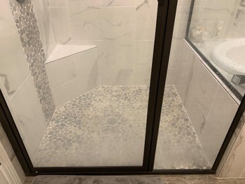 Reviewer's shower door before using cleaner