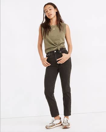 Model in the same pants showing the pockets in the front 