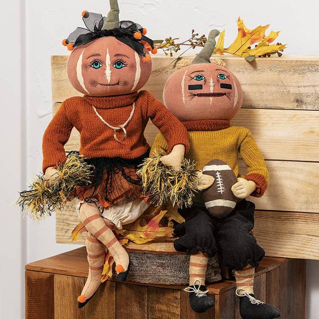 cheerleaders and shot subordinate pumpkin headed dolls