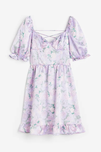 a lavender satin dress with flowers on it and puffy sleeves