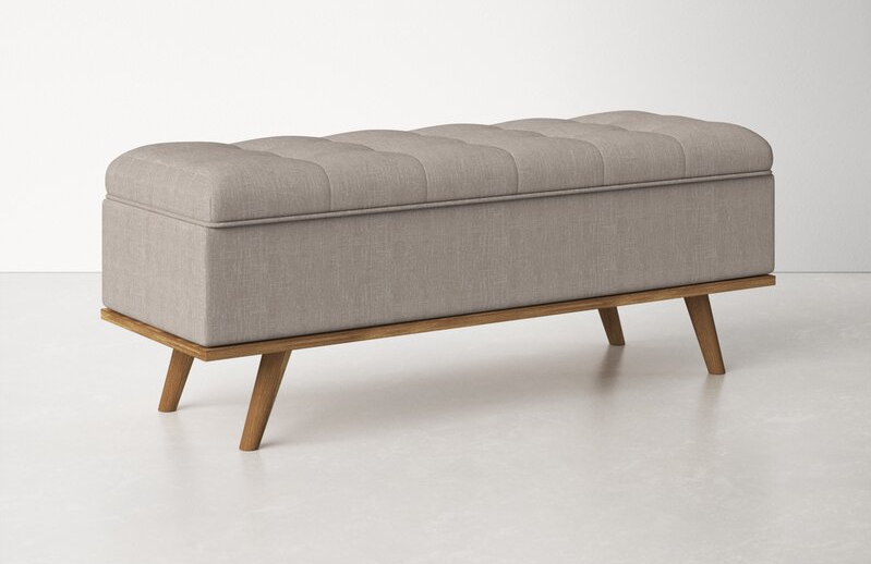 the gray storage bench with wooden legs