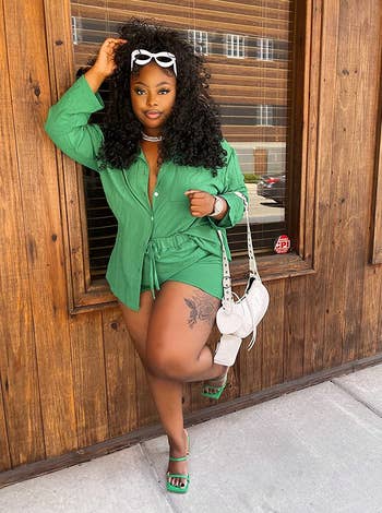 reviewer wearing the long-sleeved blouse and drawstring shorts set in dark green
