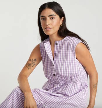 model wearing the dress in purple gingham