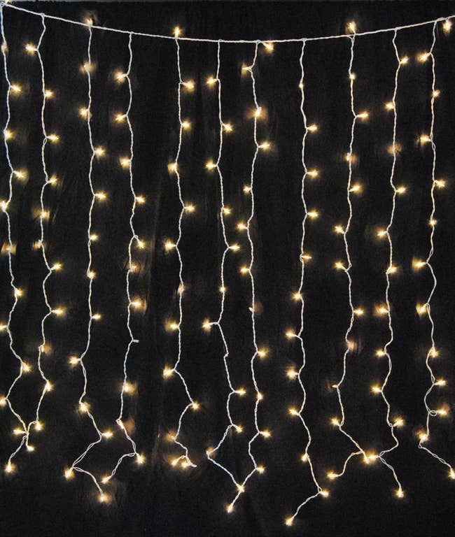 Hanging string lights forming a curtain effect, perfect for home decoration or events