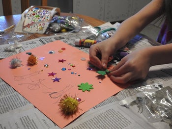 Reviewer's photo of their child doing a craft