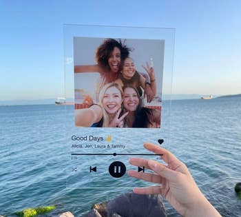 clear music setting image with picture of friends held in front of an ocean 