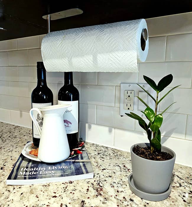 paper towel holder installed under reviewer's cabinet