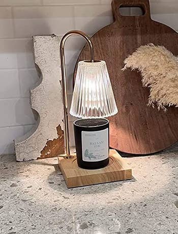 reviewer photo of the lit lamp on a kitchen counter