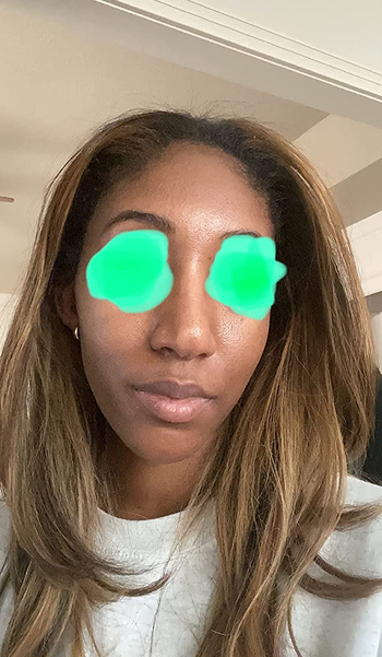 reviewer with darker skin wearing the sun-gel version