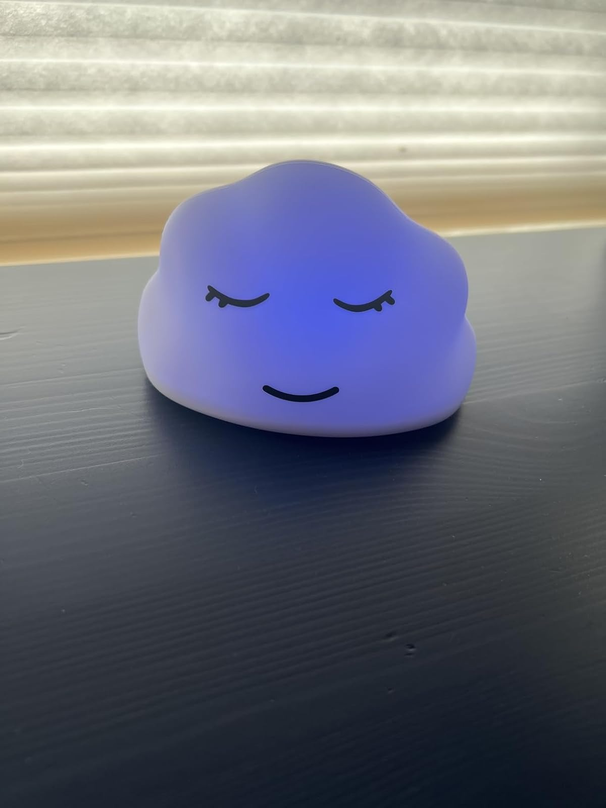 Cloud-shaped nighttime  airy  with a serene face, resting connected  a acheronian  aboveground  beneath  a model   with blinds