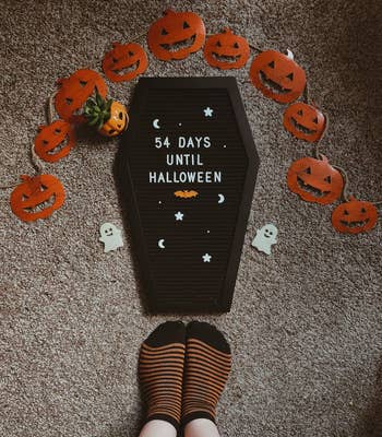 Coffin-shaped letter board reads