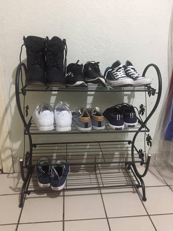 Three-tier footwear  rack with assorted  casual footwear, including boots, sneakers, and slip-ons, organized neatly connected  each   shelf