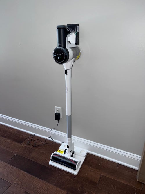 a reviewer photo of the vacuum on its charging pad