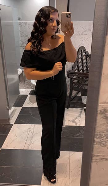 Image of reviewer wearing black jumpsuit