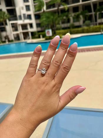 Hand displaying the press-on nails