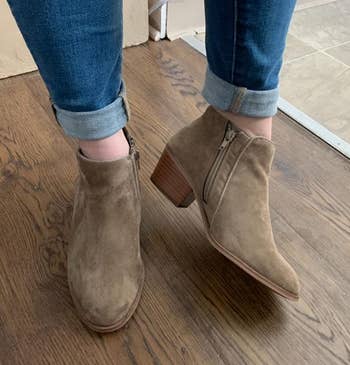 Image of reviewer wearing taupe boots
