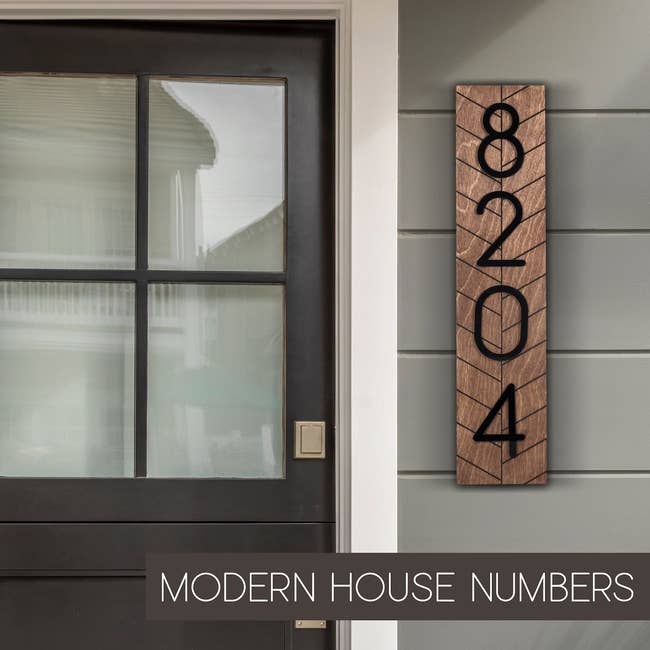 front door of house with house numbers beside it 