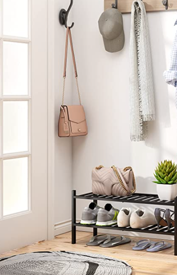 The black two-tier rack in an entryway