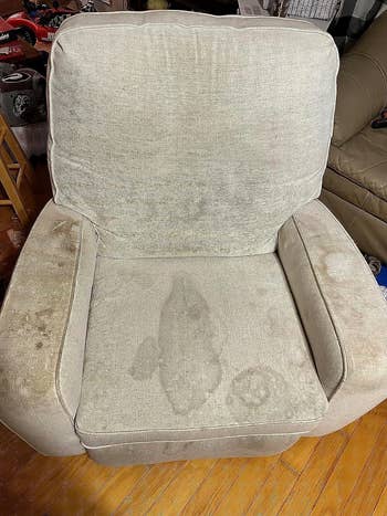 Grey fabric chair multiple stains
