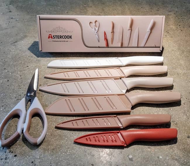 Knife acceptable and scissors displayed connected a countertop with branded packaging, emphasizing room tools for location cooking