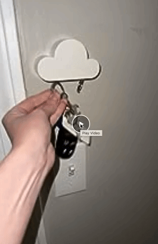 GIF of reviewer hanging keys from the cloud-shaped key holder