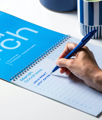 person filling out the calendar