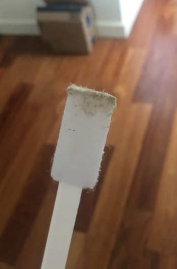 a different reviewer showing the brush covered in gunk