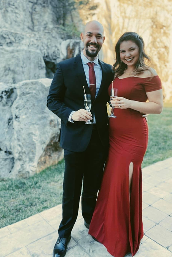 reviewer wearing the long red dress