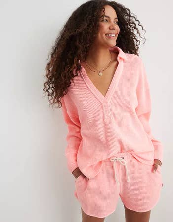 a model in a waffle knit pink top