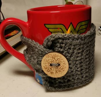 The mug sweater on a reviewer's red cup