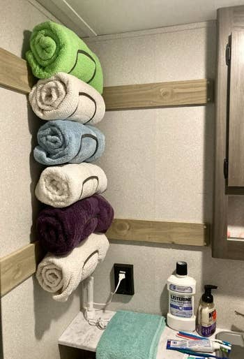 rack holding six towels in a reviewer's camper bathroom