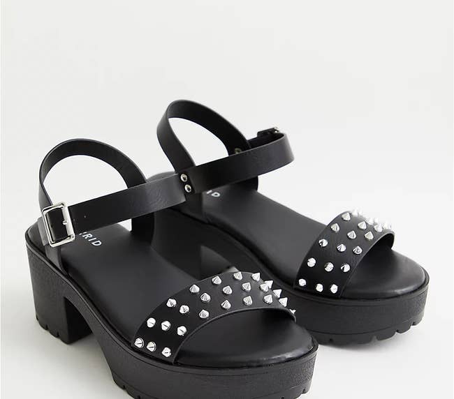 the chunky black sandals with stud detailing on the front